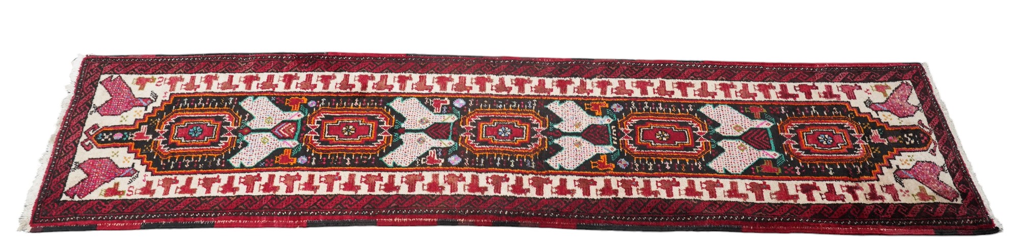 A Turkish red ground geometric runner, 266 x 63cm. Condition - good